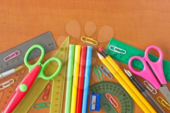 various school supplies on the wooden table