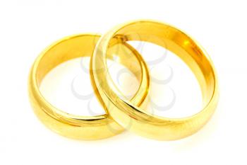 Pair of golden wedding rings on a white background