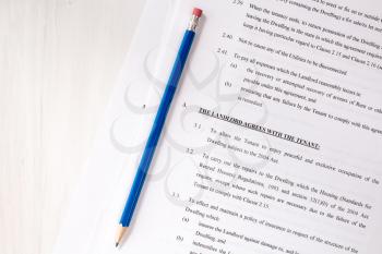 Pencil with agreement between landlord and tenant