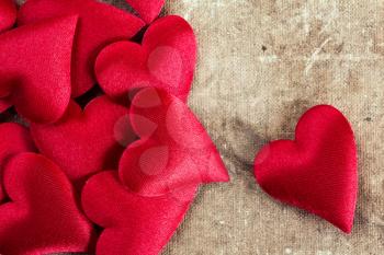 Decorative hearts pile on old canvas background