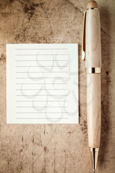 Wooden pencil and empty paper note for your text