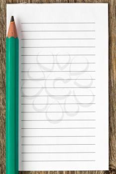 Pencil and blank lined paper for your text