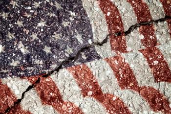 USA flag on cracked asphalt background