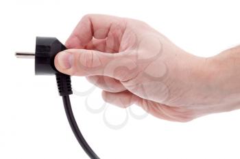 Hand holding electric plug isolated on white background