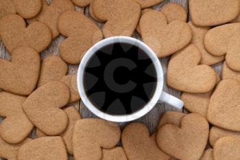 Cup of coffee with a gingerbread cookies, top view