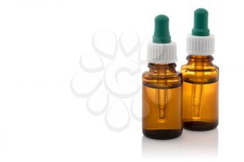 Brown medicine glass bottles with droppers isolated over white 