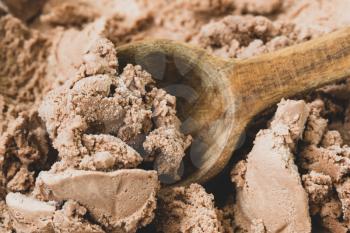 Chocolate ice cream with a spoon, close-up view