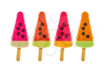 Four assorted fruit popsicles isolated on a white background