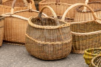 Group of empty wicker baskets for sale in a market place