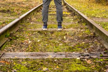 Man standing on the railway. Concept for new life begining
