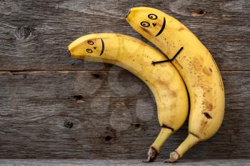 Couple of bananas hugging each other .Concept of embracing couple in love and tenderness.