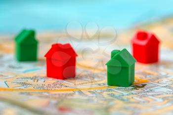 Global or world property, house and home loan, real estate or mortgage loan concept. Map with group of small cute miniature houses.