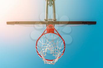 Bottom view of a basketball hoop for playing streetball on an outdoor playground 