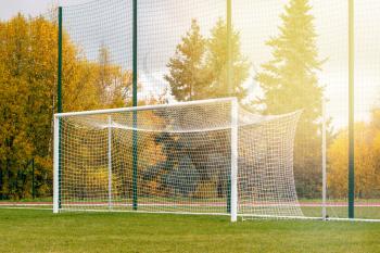 Gate on a soccer field. Football goals on countryside field.