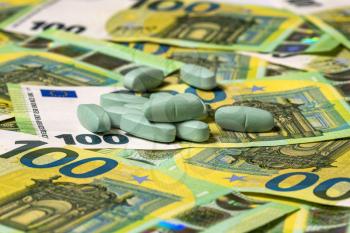 Medicine pills over euro banknotes. Money, healthcare and drug trafficking concept.