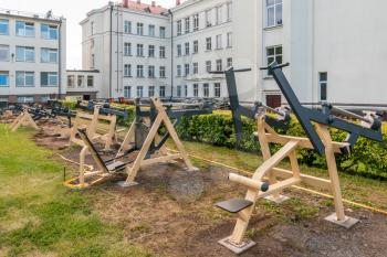 Exercise machines being installed.New training complex in the courtyard of a school building.