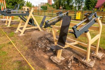 New exercise machines being installed in the courtyard of a school.