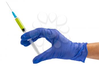 Hand in a blue glove holding syringe isolated on white. Medical concept with syringe for vaccination.