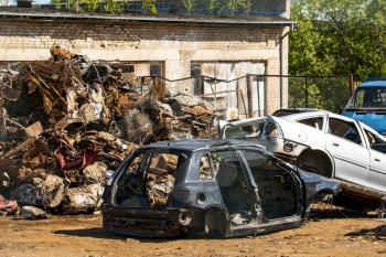 Damaged  cars waiting in a wreckyard to be recycled 