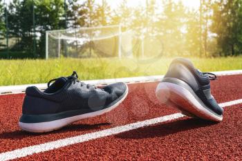 Running shoes on racetrack. Healthy lifestyle concept.
