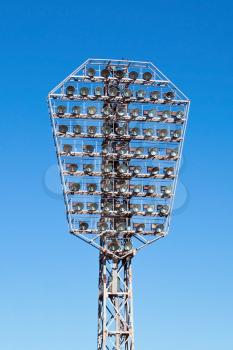 Football stadium projector on blue sky
