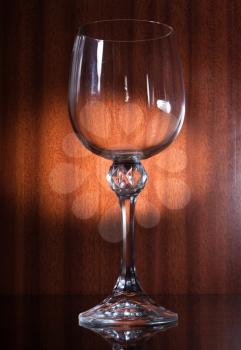 Empty glass on the brown wooden  background