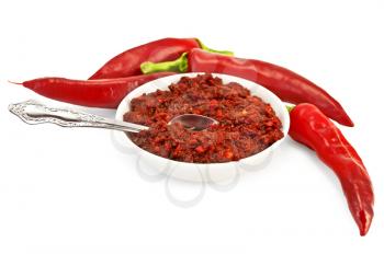 Royalty Free Clipart Image of a Cup of Chilies With Peppers Around It