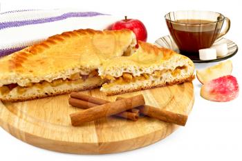 Royalty Free Photo of Apple Pie With Cinnamon Sticks and a Cup of Tea