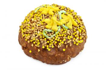 Brown sandy cake with yellow and green decoration of sweets, nuts isolated on a white background