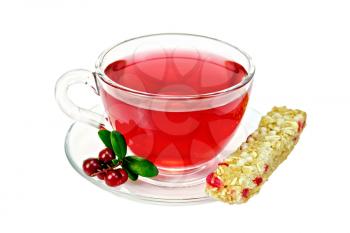 Tea in a glass cup, berries and green leaves cranberries, granola bar isolated on white background