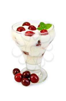 Thick yogurt with cherry in a glass goblet, cherries isolated on white background