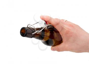 Royalty Free Photo of a Hand Tipping an Empty Beer