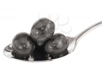 Royalty Free Photo of Black Olives on a Spoon