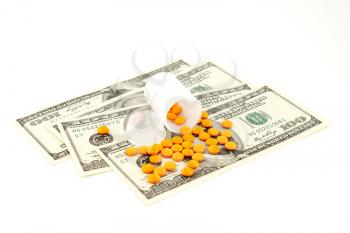 Royalty Free Photo of a Pill Bottle on Money