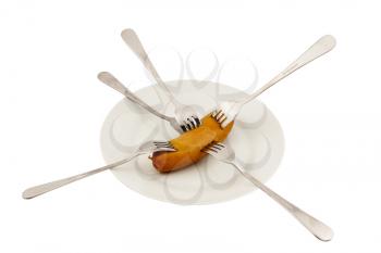 Royalty Free Photo of a Sausage on a Plate With Forks in It
