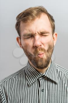 Man sucking in his cheeks
