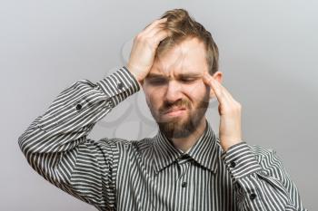 man trying to remember something with headache