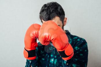 Brunette man with boxing gloves