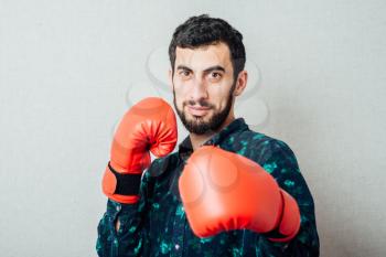 Brunette man with boxing gloves