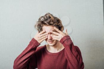 man covers his face