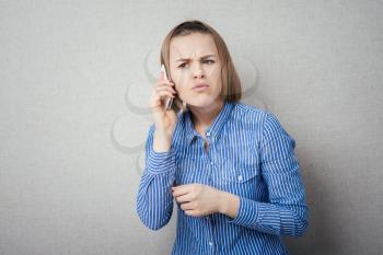 girl listening displeasure mobile phone