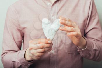 Man holding a heart in his hands