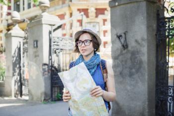 young girl tourist with map in hand