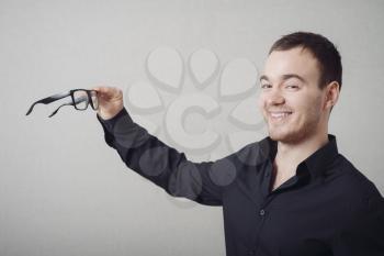 Portrait Of Thinking Man Wearing Eyeglasses Isolated On Grey Background