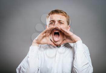 portrait of young man screaming