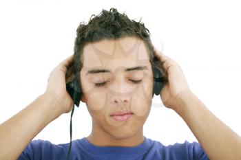 Boy listening to the music, isolated on white