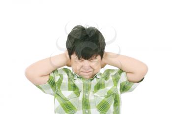 Little boy closing his eyes and ears with his hands, isolated on white 