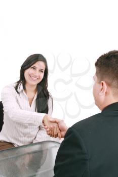 Two businesspeople, or business person and client handshaking at office 
