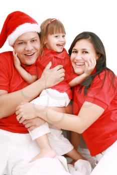 Portrait of happy family looking at camera and prepared for Christmas