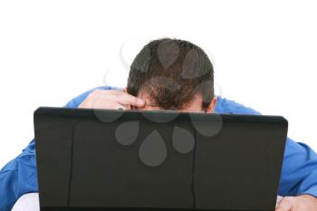 A bald man hiding behind his laptop computer screen. 